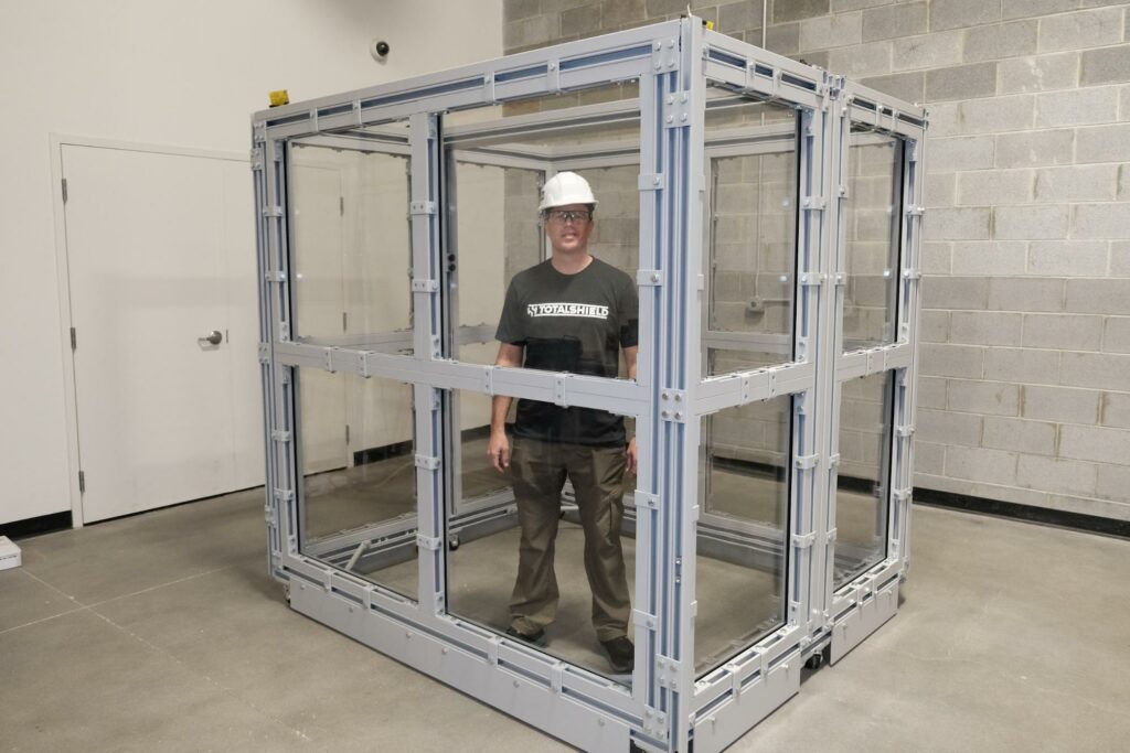 Small polycarbonate shield enclosure built with two mobile shield barriers.