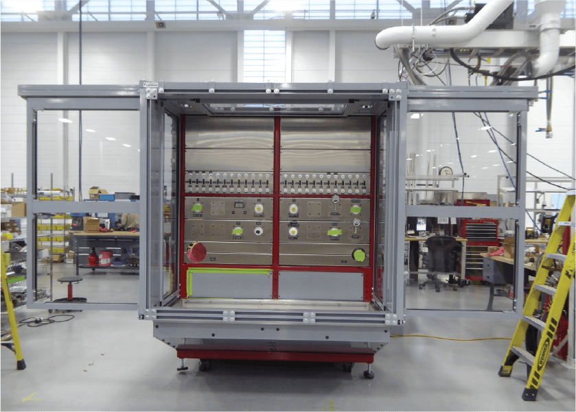 Machine guard enclosure designed with a test stand and covered ceiling.